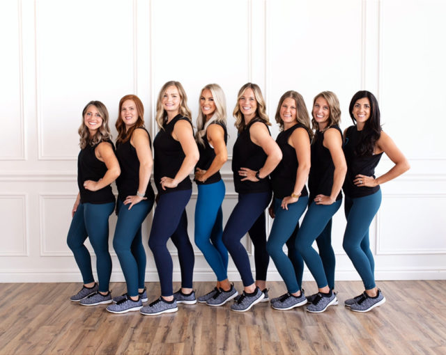 Group of women posing in matching athletic wear at our luxury hotel in Birmingham