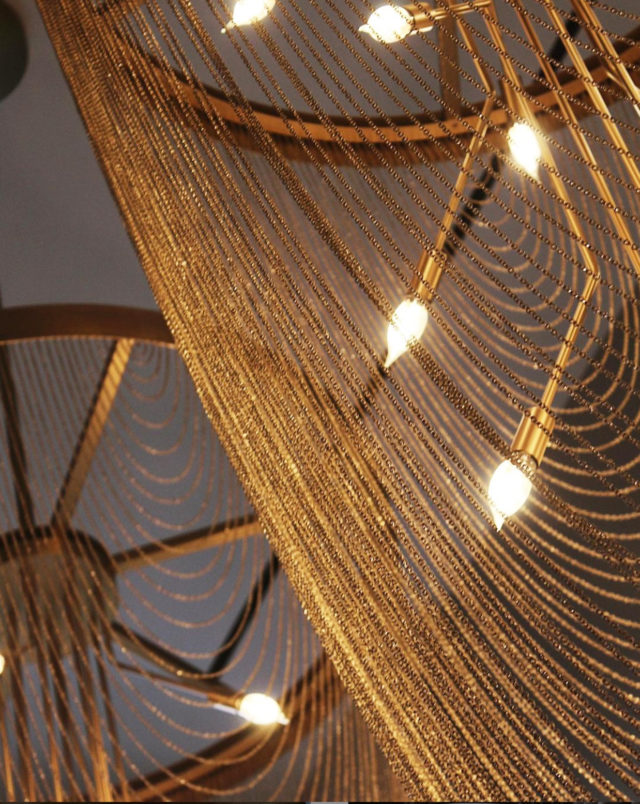 Intricate gold lighting in madam restaurant near Detroit, MI