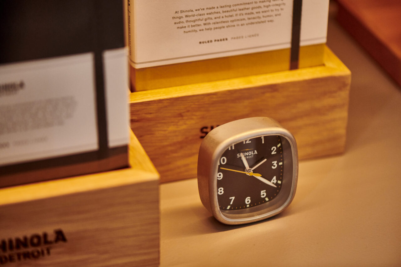 Focus on the Shinola alarm clock in front of its display box at the Daxton Hotel