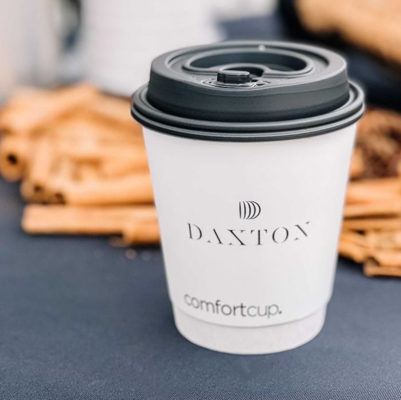 Complimentary white cup with the Daxton logo on it filled with Hot Chocolate at our Birmingham boutique hotel in Michigan