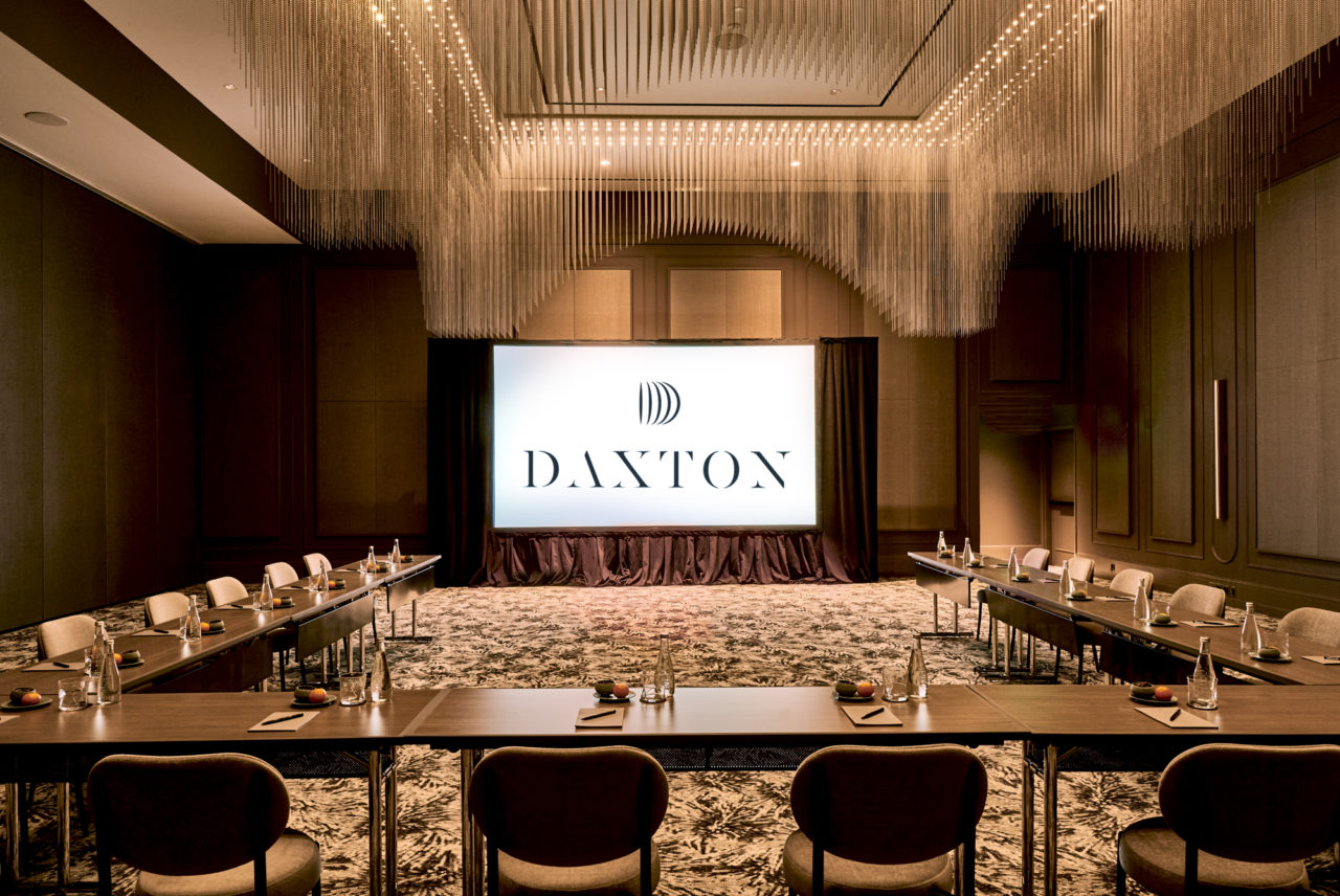 Event space in Birmingham, MI set up in a U formation facing the screen at the Daxton Hotel