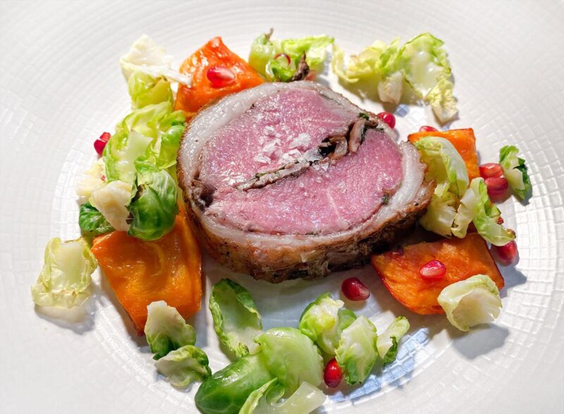 Roasted Stuffed Rack of Lamb with sweet potatoes and brussel sprout leaves at daxton hotel's restaurant madam
